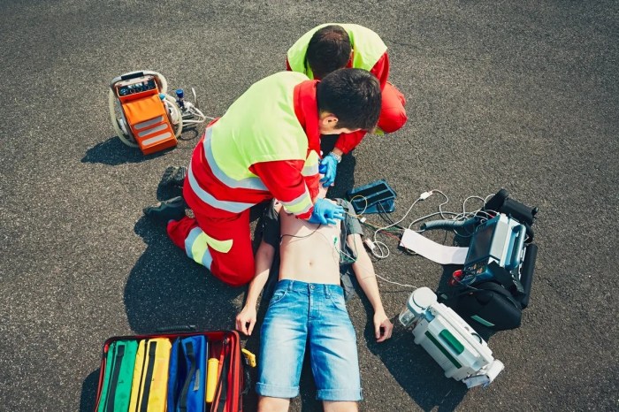 Two rescuers begin high quality cpr